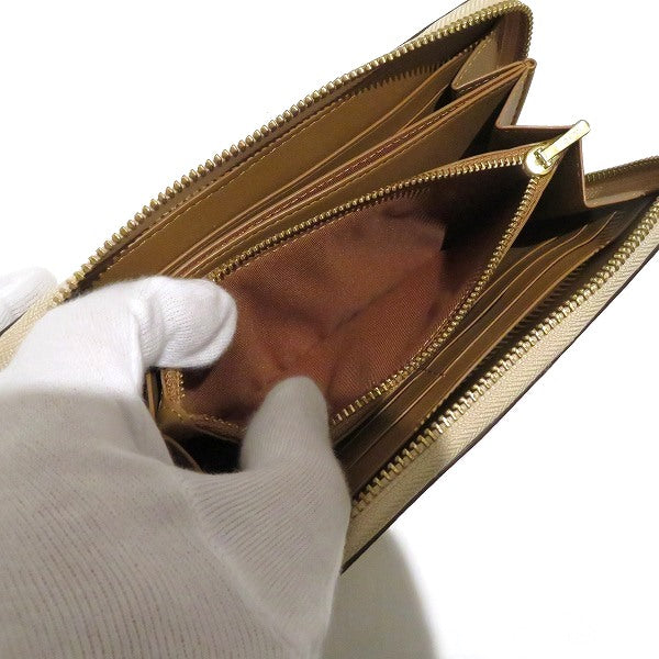 コーチ アコーディオン ジップ ウォレット フローラル