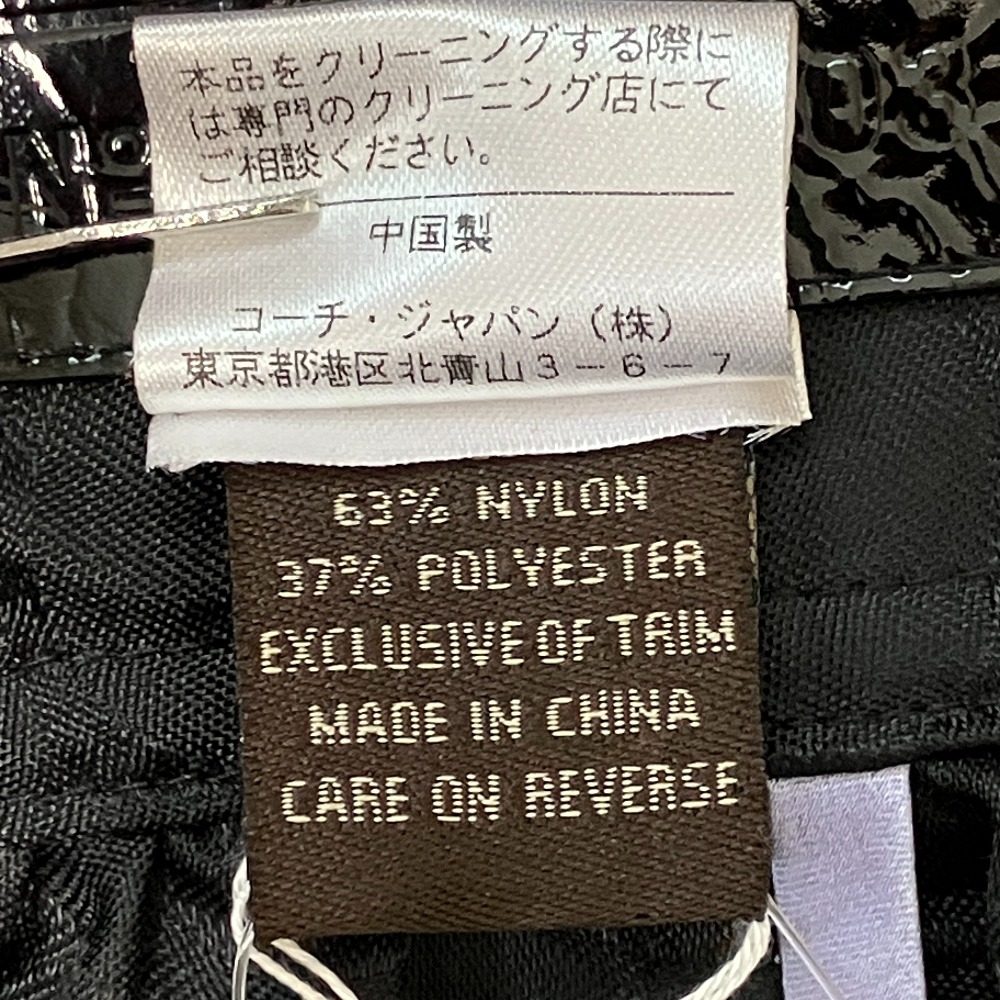 コーチ シグネチャー ナイロントレンチコート