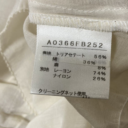 マルティニーク 裾リボンツイストタックシアーショートスリーブシャツ