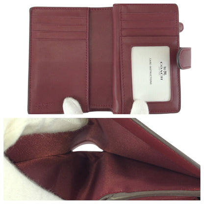 コーチ フローラル PVC レザー財布